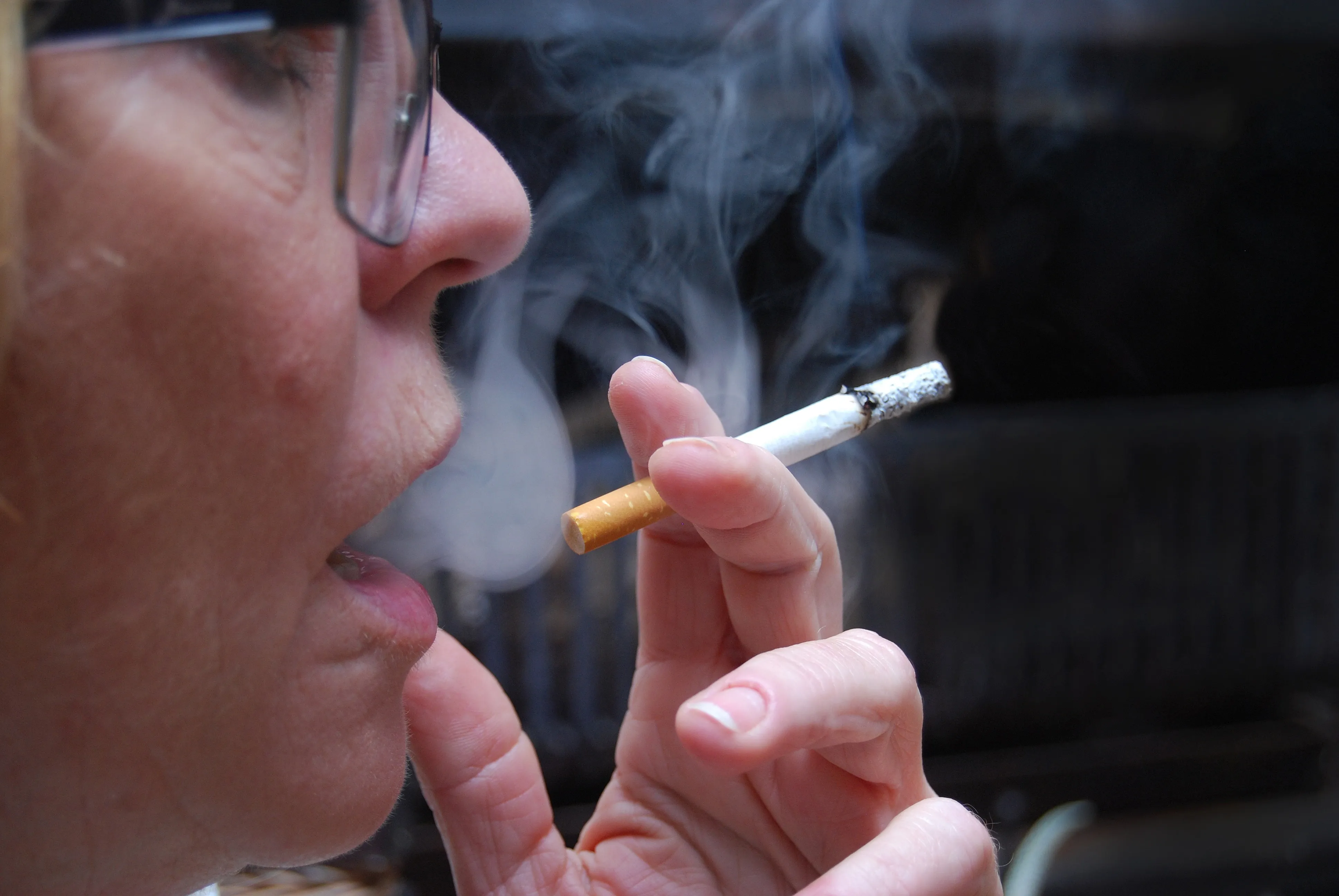 Woman smoking a cigarette, illustrating habits that hinder a church's spiritual health
