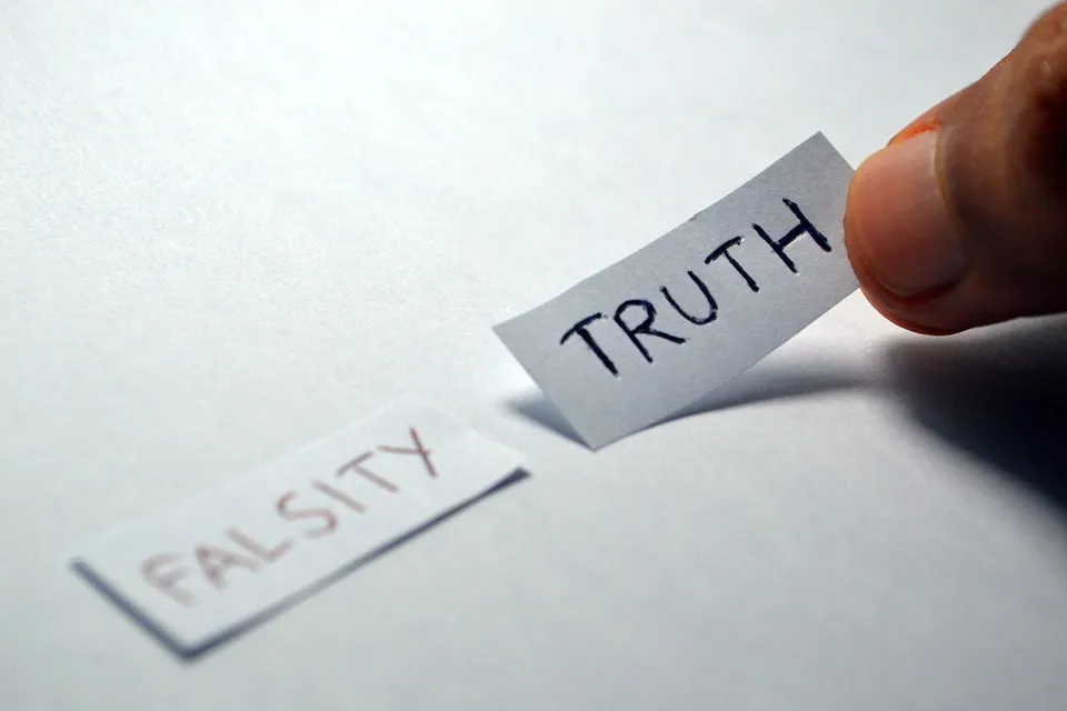Paper slips labeled Truth and Falsity, illustrating biblical discernment