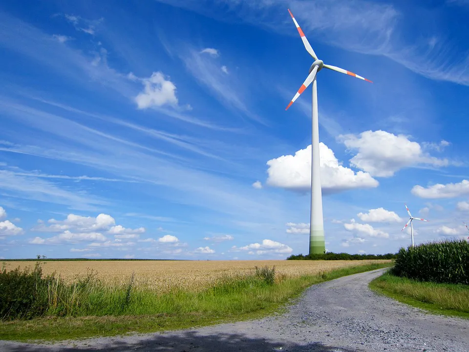 Wind turbine under a blue sky, picturing the unseen power of the Holy Spirit's gifts