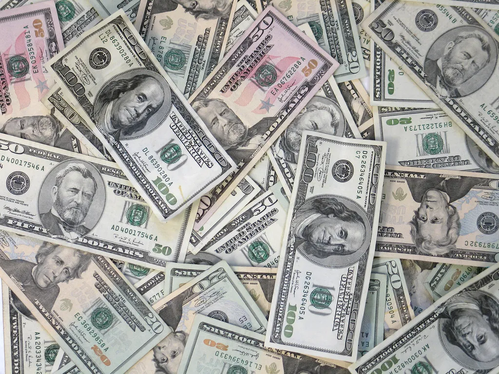 Pile of U.S. dollar bills, for a study of tithing in the Old Testament