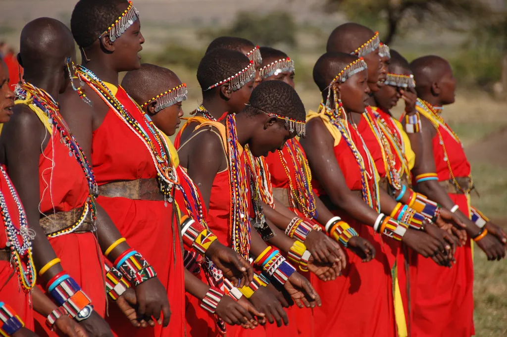 East African tribal women in traditional red dress and beaded collars, people yet to hear the gospel