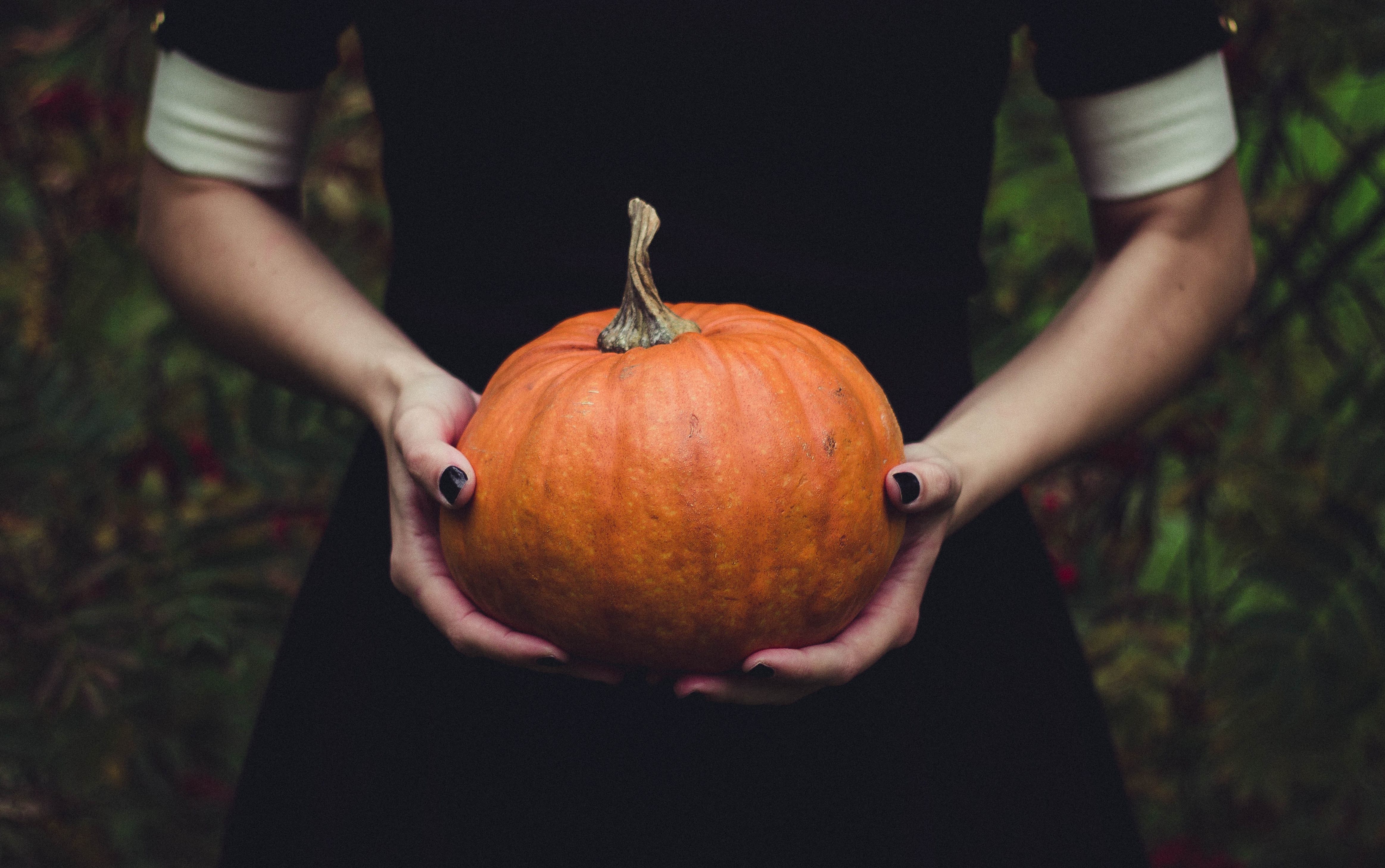 Woman holding Halloween pumpkin